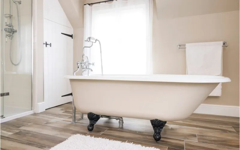 For a piece on bathroom ideas, a clawfoot tub sits in a modern open farmhouse bathroom
