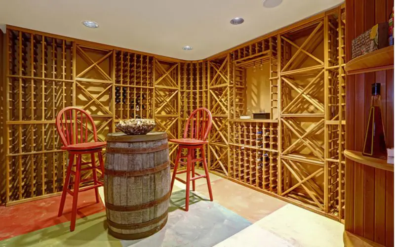 Basement idea including a wooden wine cellar surrounding an aged oak wine barrel