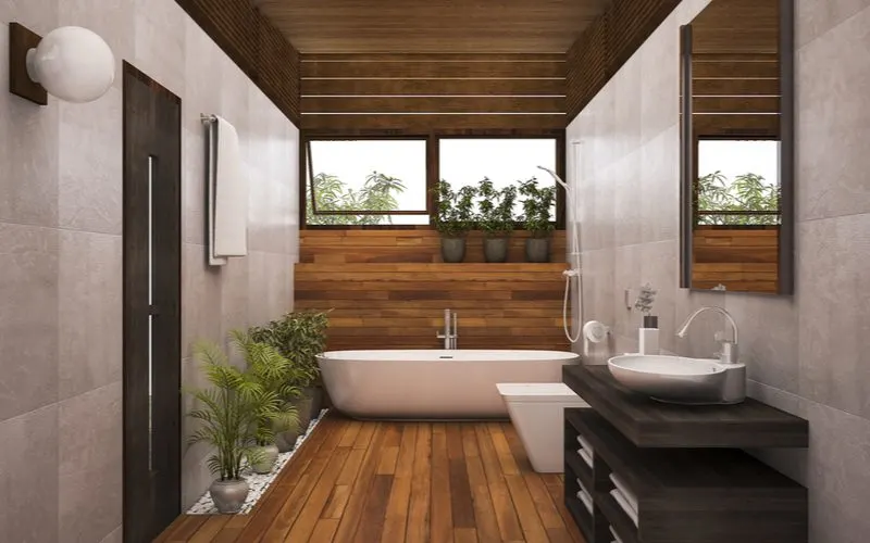 Contemporary wooden bathroom idea with grey slate tile walls and modern dark brown wood