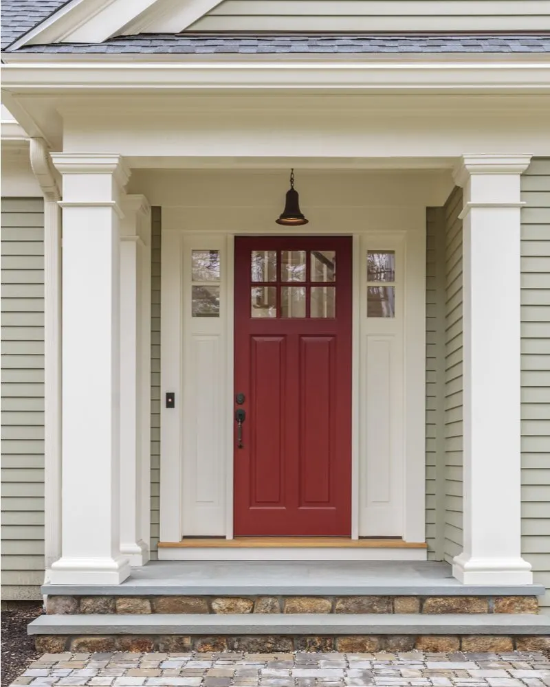 Example of a red door idea on a Colonial style modern house on the East Coast