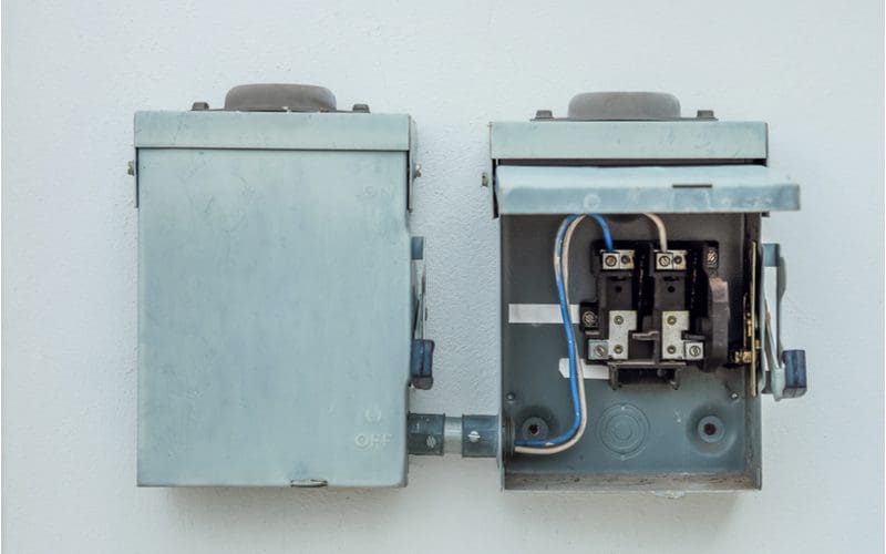 Power breaker box for an air conditioner compressor