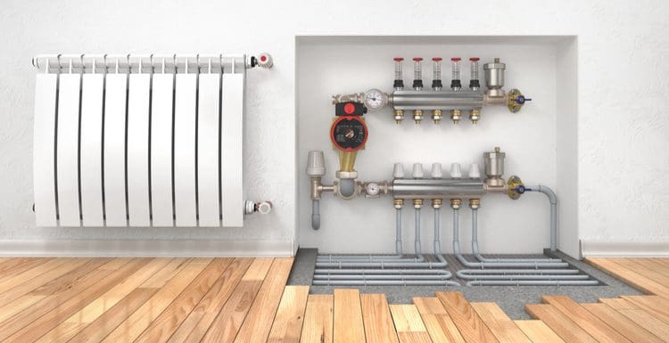 Cutaway of the pipes and boiler involved in a hydronic floor heating system