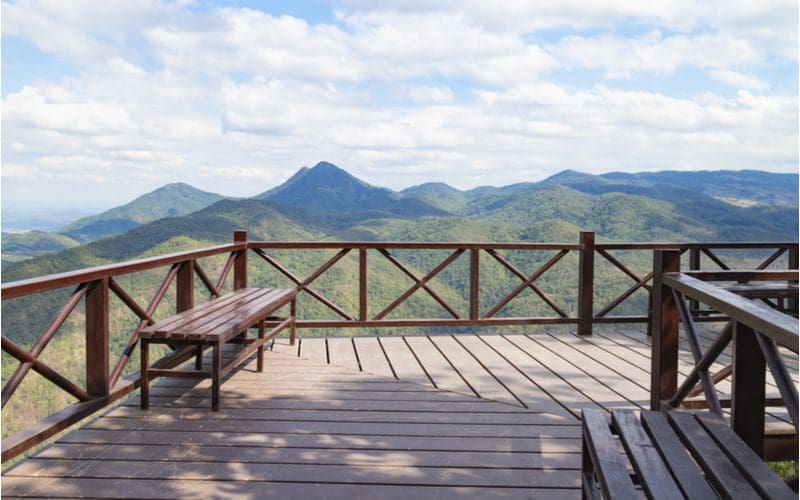 Crossed slat deck railing idea found in Costa Rica overlooking a gorgeous green volcano
