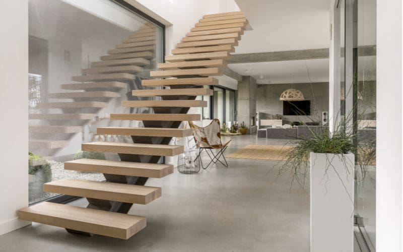 Stair trim ideas in a modern mansion with floating stairs going to the top floor