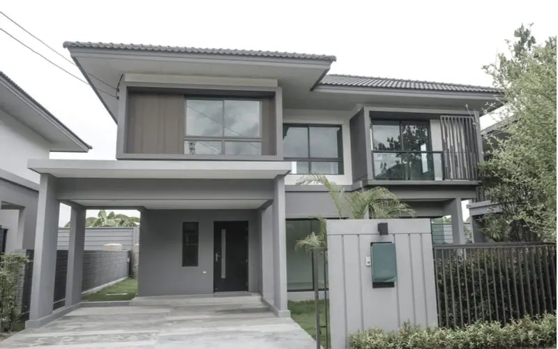 Modern Light Grey House With Black Fence