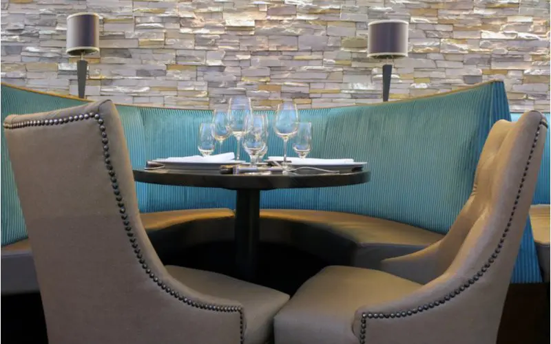 Basement bar idea for booth seating in teal and tan leather seating areas