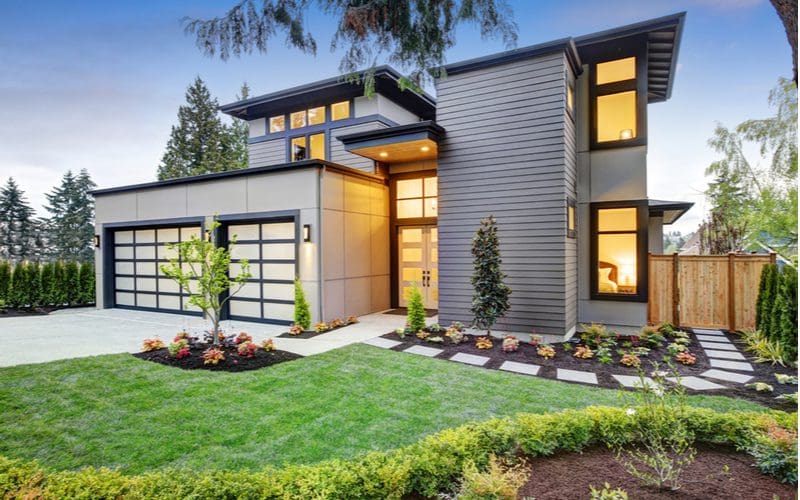 Modern and luxurious two-story home that's super boxy and painted grey