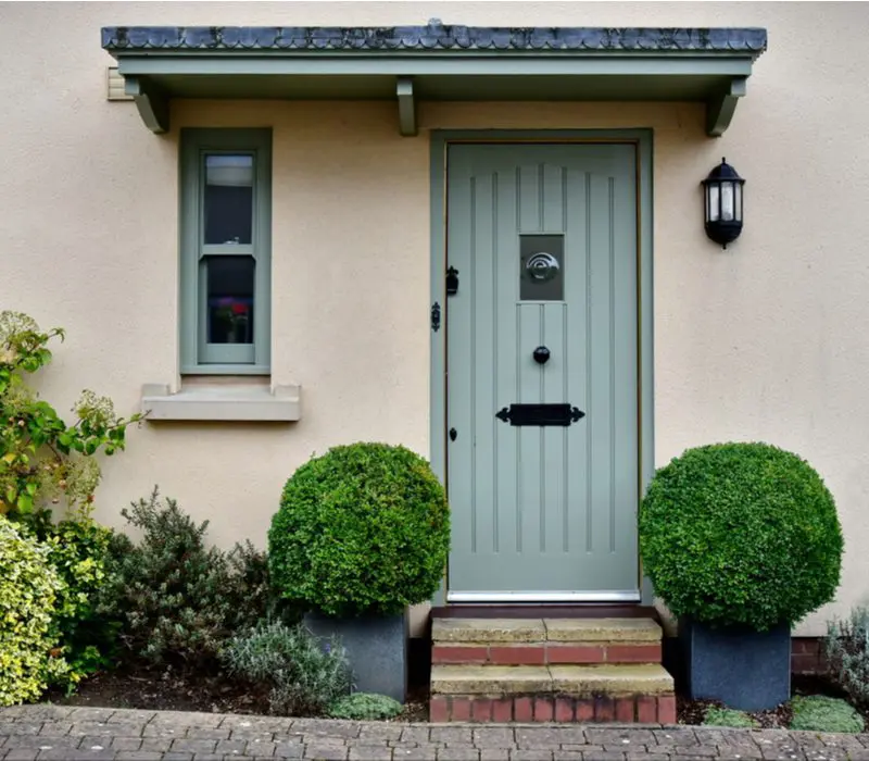 Seafoam green, one of the top front door colors for tan houses
