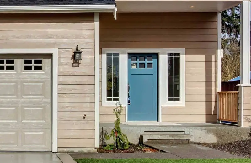 Light blue door on a house with light blue exterior