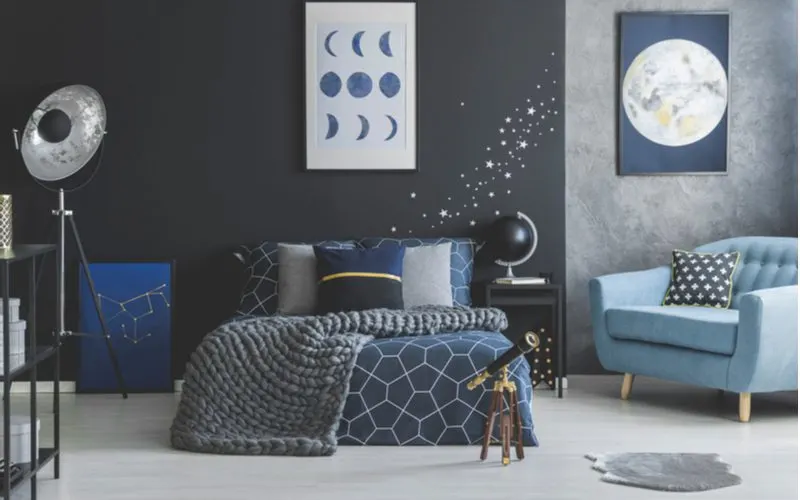 Blue-grey bedroom idea featuring star-themed decor and bedding