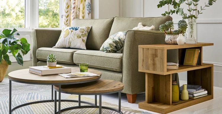 Coffee table décor sitting in the middle of a living room with wood paneling
