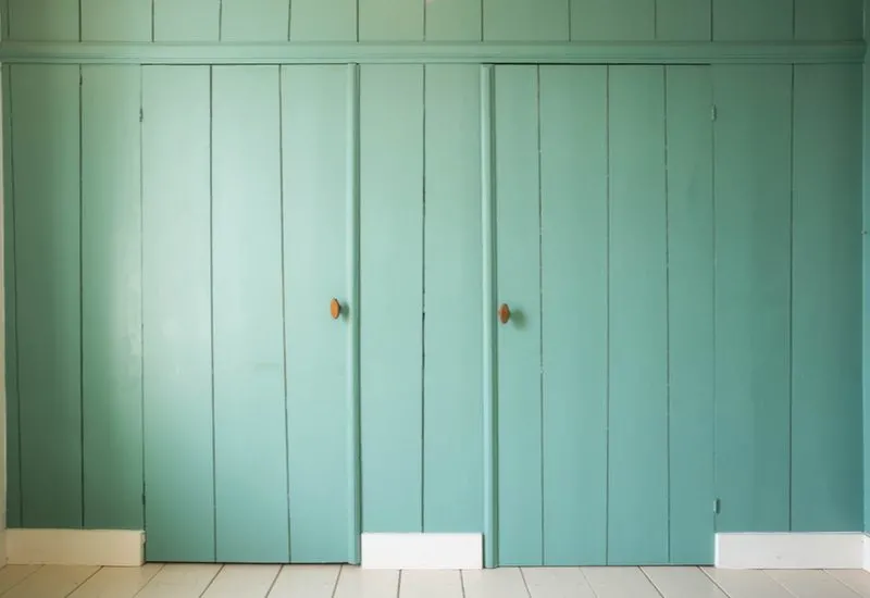 Vintage Green Wooden Doors with exposed hinges as an example of unique closet door ideas