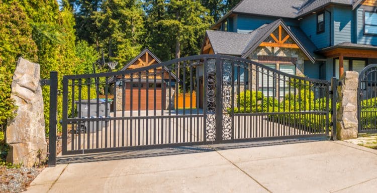 Metal driveway gate idea for a featured image for a roundup on the topic