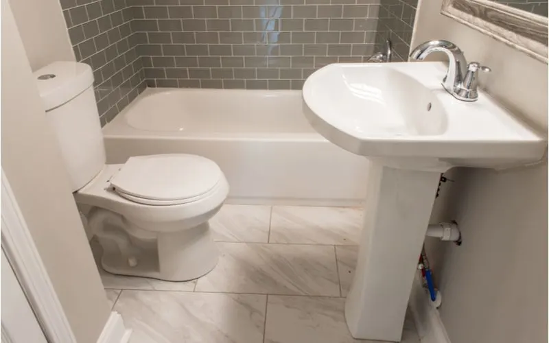 Image showing a small size round toilet in a half bath