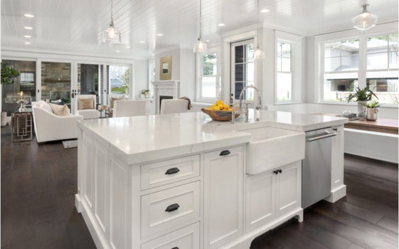 Gorgeous farmhouse style kitchen with a beautiful farmhouse tile on the walls and a shiplap-style wainscoted ceiling