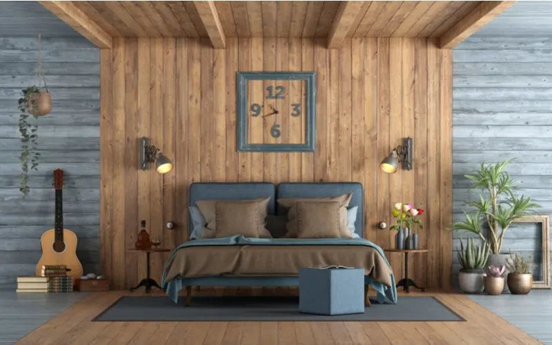 Rustic men's bedroom idea featuring grey wood running horizontally and natural brown wood running vertically with a black bed sitting on a black rug