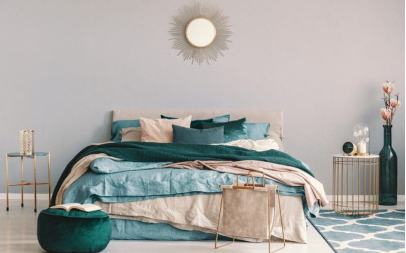 Teal bedroom ideas showing a very faint teal painted wall with such a color bedding