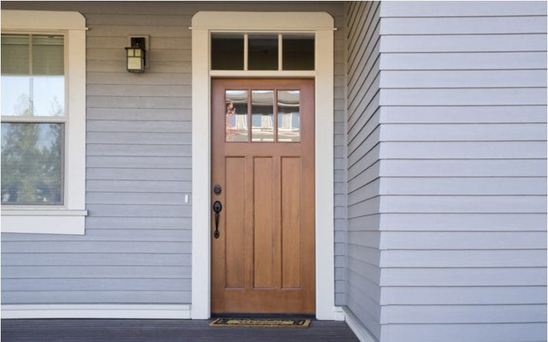Brown front door on a gray house idea