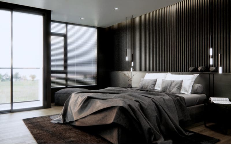 3d rendering of a dark wooden paneled room with pendant lights above the ceiling and masculine bedding on the bed