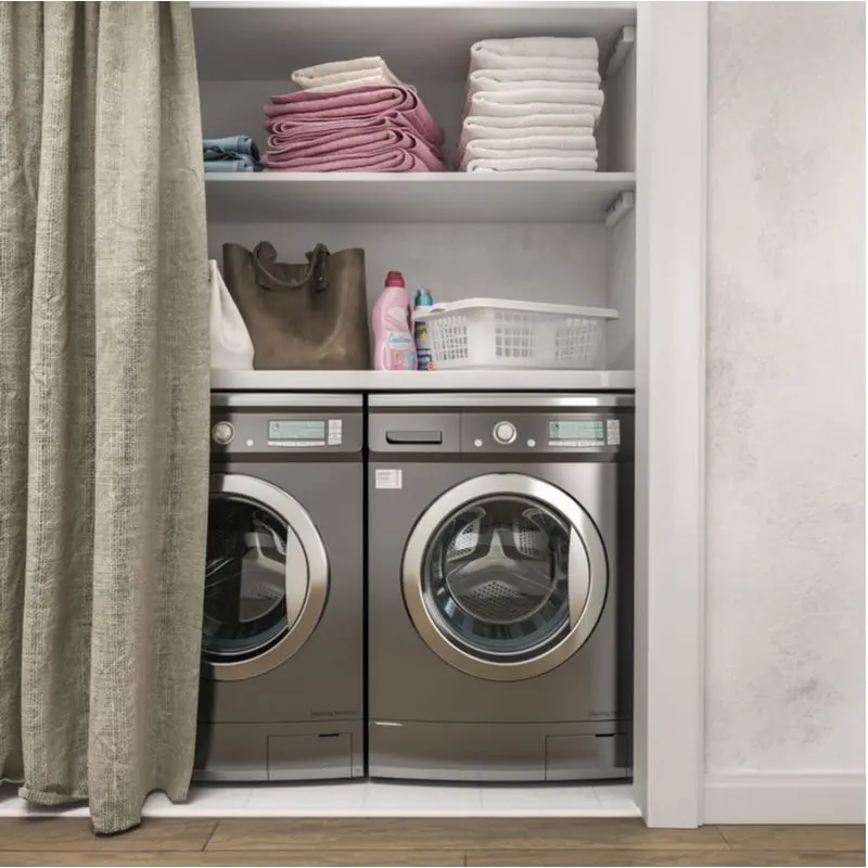 As an example for a budget closet door idea, a closet laundry room with a curtain hanging in front of the washer and dryer and in-wall shelving