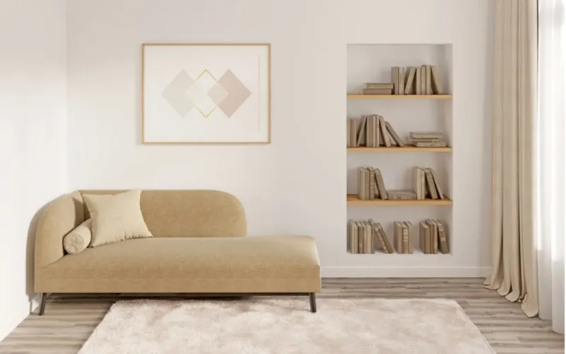 Simple geometric art decor idea above a couch in a muted earth-tone tan and light brown and cream room
