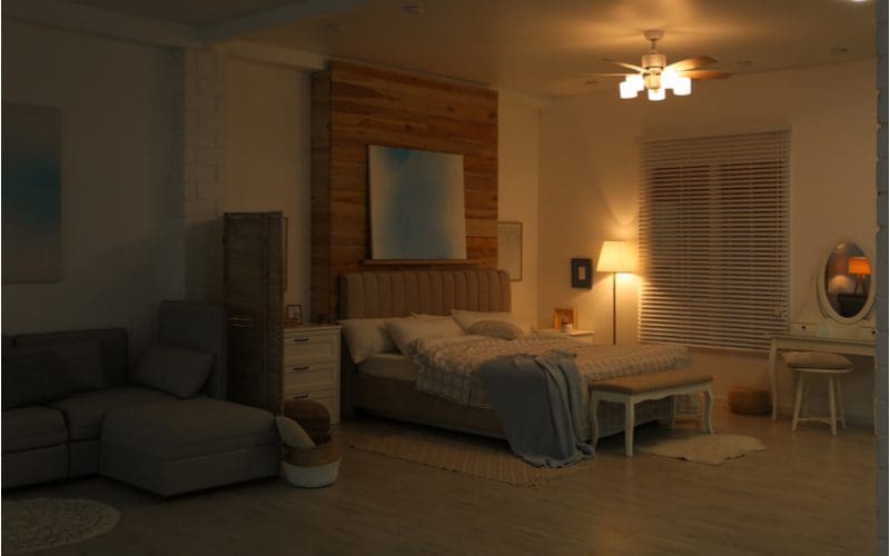 Couch in bedroom idea with a couch separated by a small room divider
