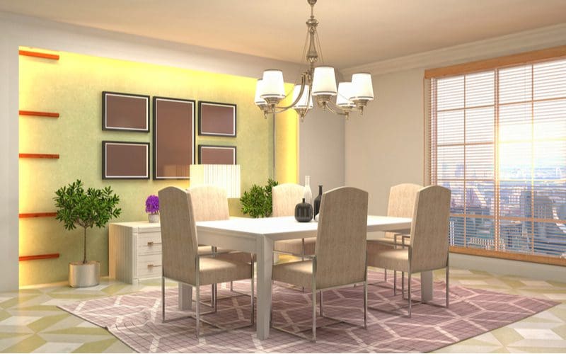 Photo of a modern and gorgeous dining room wall decor idea with a well-lit yellow wall