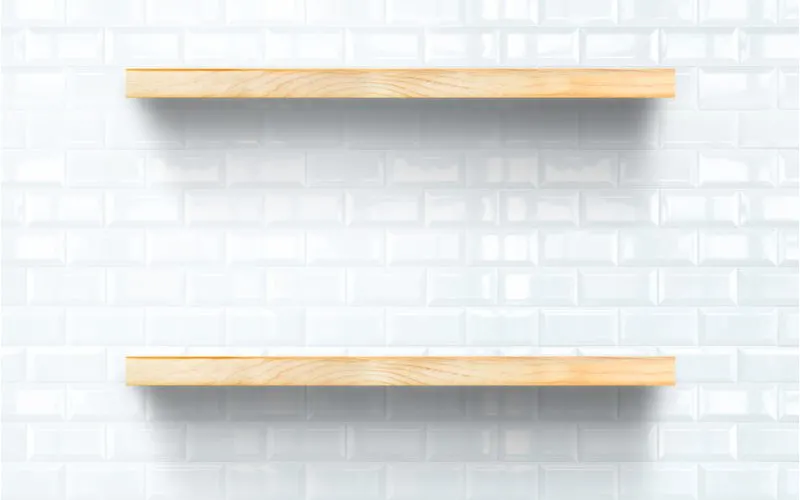 As an example of unique bathroom shelf ideas, floating natural wood tile shelves attached to white subway tile backsplash