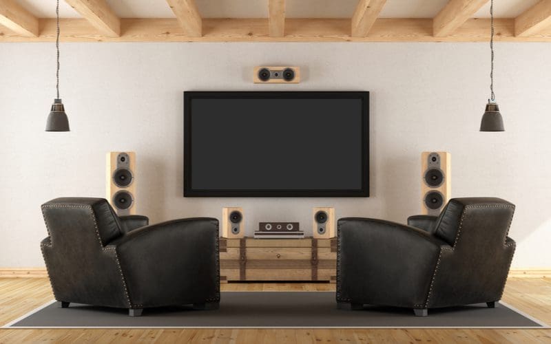 Stereo system inside a white room with exposed natural wood beams as a man cave idea