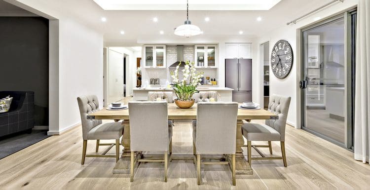 For a piece on dining room table centerpiece ideas, a modern grey and white dining room sits on a light wooden floor