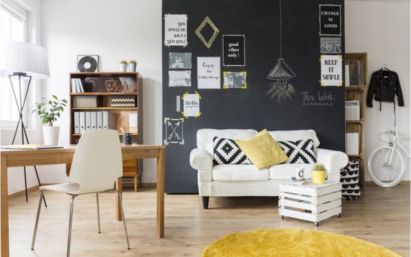 Wall decor above couch idea to paint a chalkboard on which you can draw new art every week