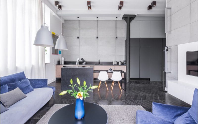 Near-Black Grey Patterned Tile Floors in a living room with light grey modular walls