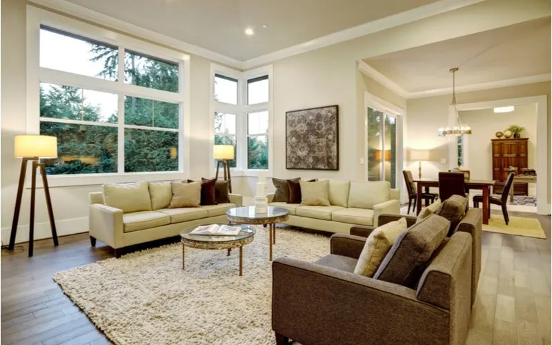 For a piece on what color goes with beige, neutral living room décor with beige sofas and dark brown couches and flooring to symbolize the neutral color combo