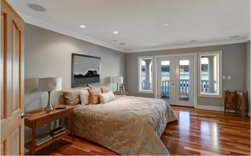 Chic master bedroom with walkout French doors for a piece on grey bedroom ideas