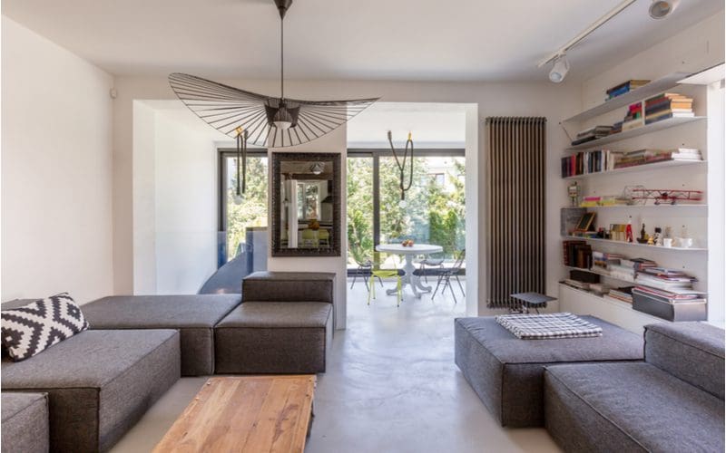 Warm and Inviting Grey Concrete living room flooring idea