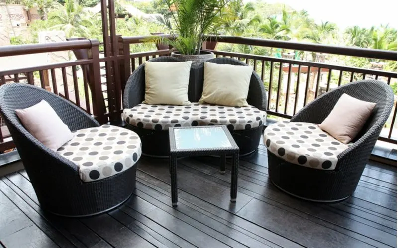 Polka dot foam cushion replacements on round chairs placed on a black deck