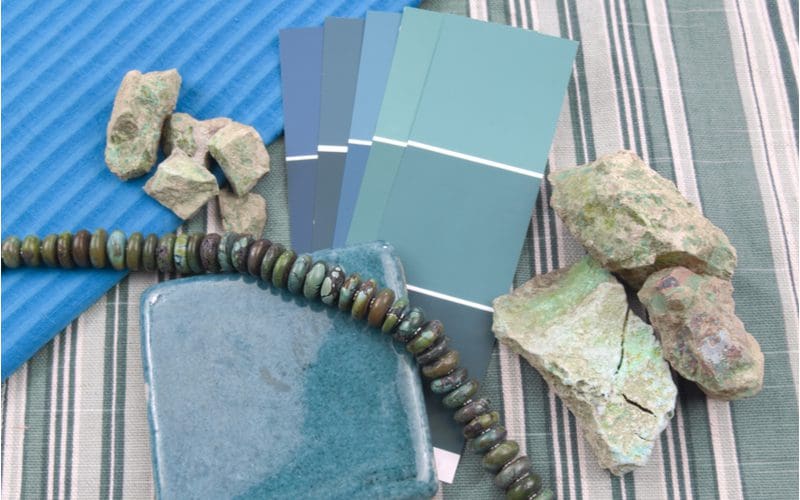 Teal bedroom ideas featuring teal paint swabs with complementary colors sitting by rock samples