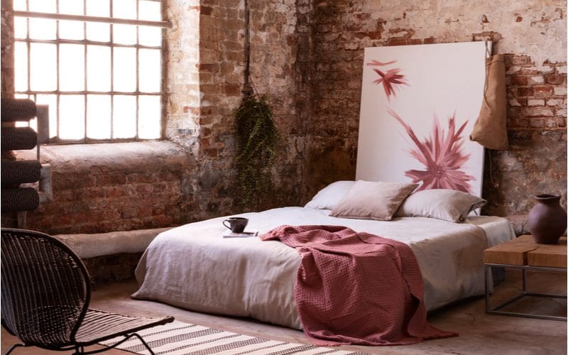 Bedroom in a loft with Accent With Feminine Touches and industrial styling