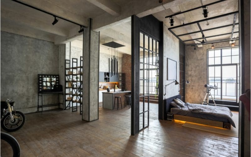 Industrial, one of the many different interior design styles, shown as the aesthetic throughout a loft-style apartment