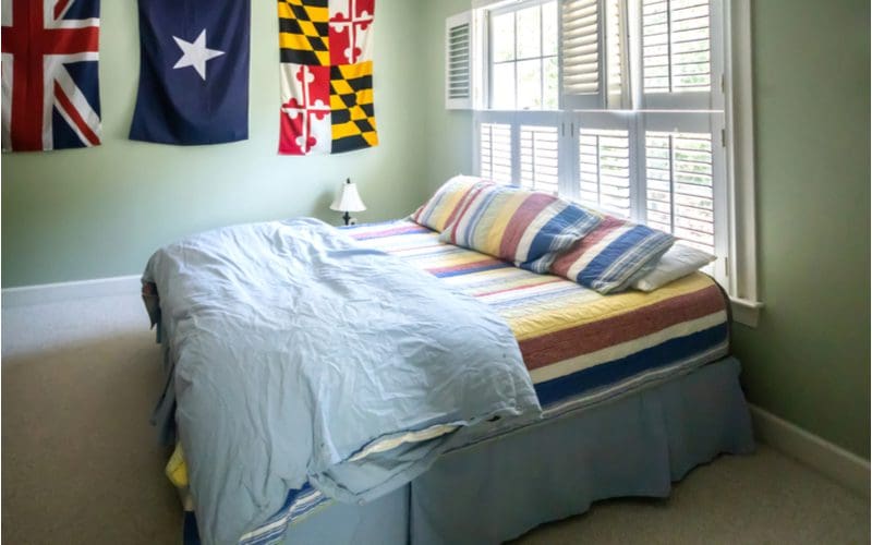 Flags of the World hang from the wall of a teen boy's room used as decorations