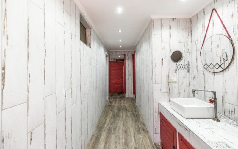 Rustic bathroom that's modern with vertical grey barnwood tile