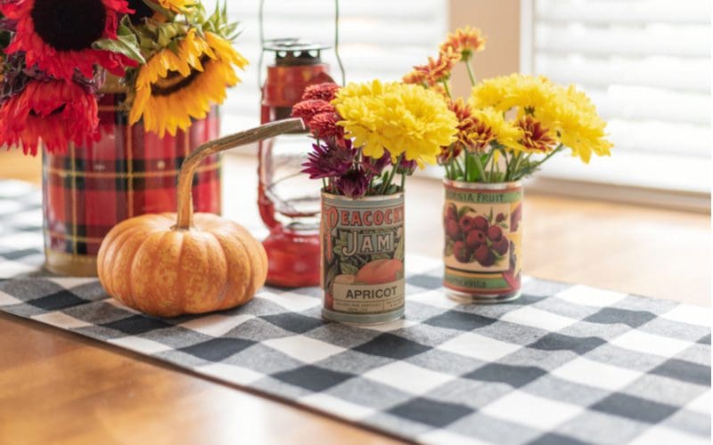 Vintage Soup Can Fall Centerpiece Idea featuring apricot and other fruits cans acting as a flower vase