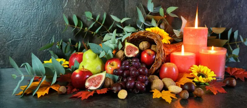 Colorful Fruit Cornucopia shown as a fall centerpiece idea