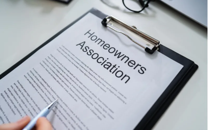 Docs that show how to legally annoy a homeowner's association on a clipboard
