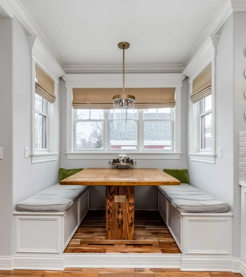 Cozy design for a breakfast nook idea featuring Built-In Table with Benches 