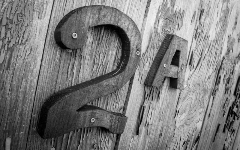 Wooden house number idea on a vertical barnwood wall