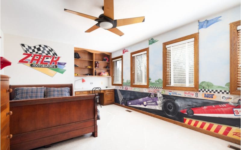 Hobby themed teen boys' room decorating idea with race cars painted on the walls