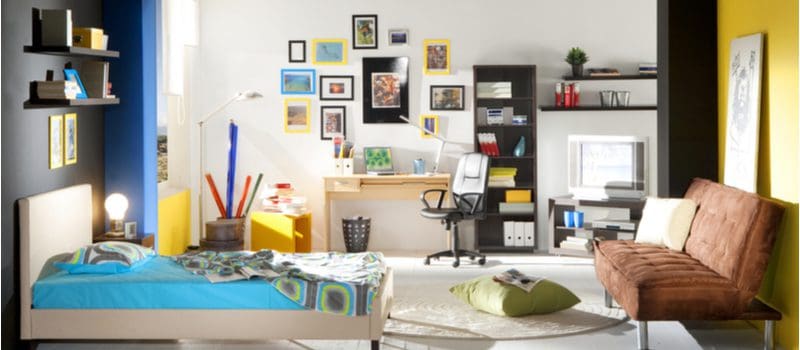 Study space featuring several pieces of colorful furniture and accent walls as an idea for a teen boys room decoration