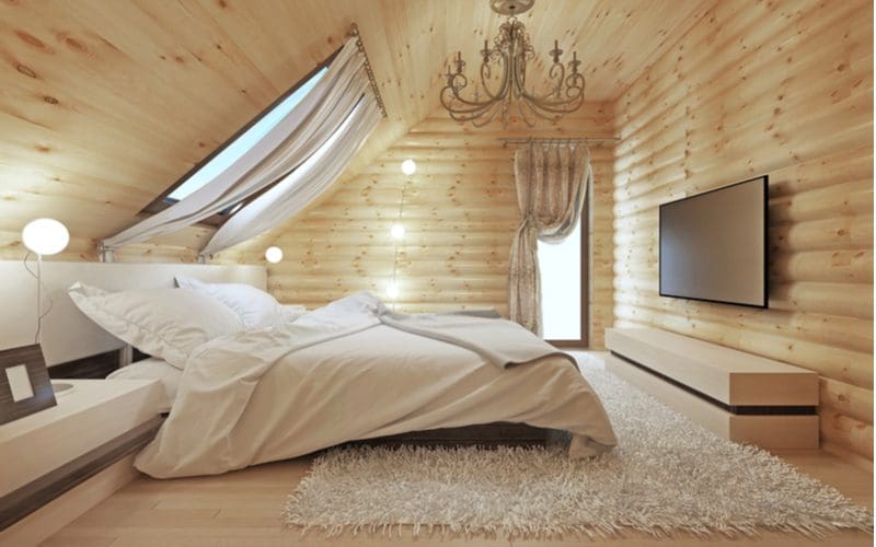 Cabin interior idea with lots of log-cabin style siding on the walls and 2x4 paneling on the walls