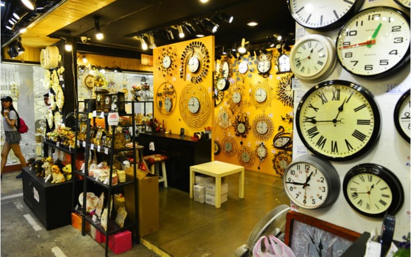 Storefront with various types of clocks hanging on the wall